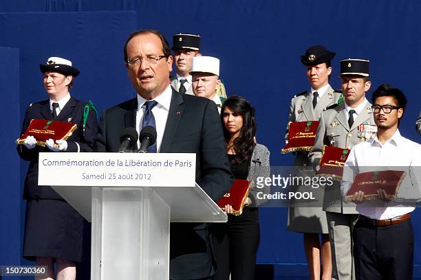 French President Francois Hollande delivers a speech during a ceremony at the Paris city hall marking the 68th anniversary of the liberation of Paris...