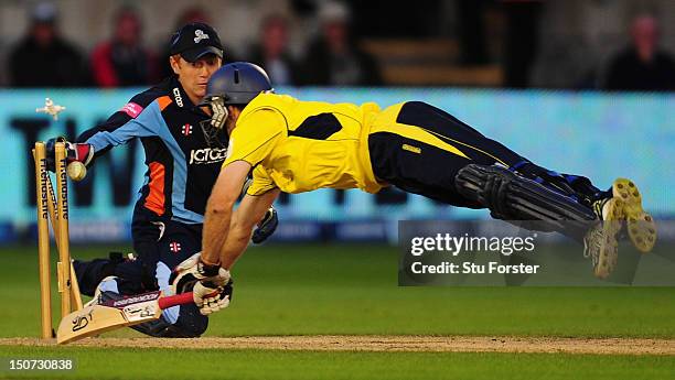 Hampshire batsman Simon Katich is run out by Yorkshire keeper Jonny Bairstow during the final of the Friends Life T20 between Hampshire and Yorkshire...