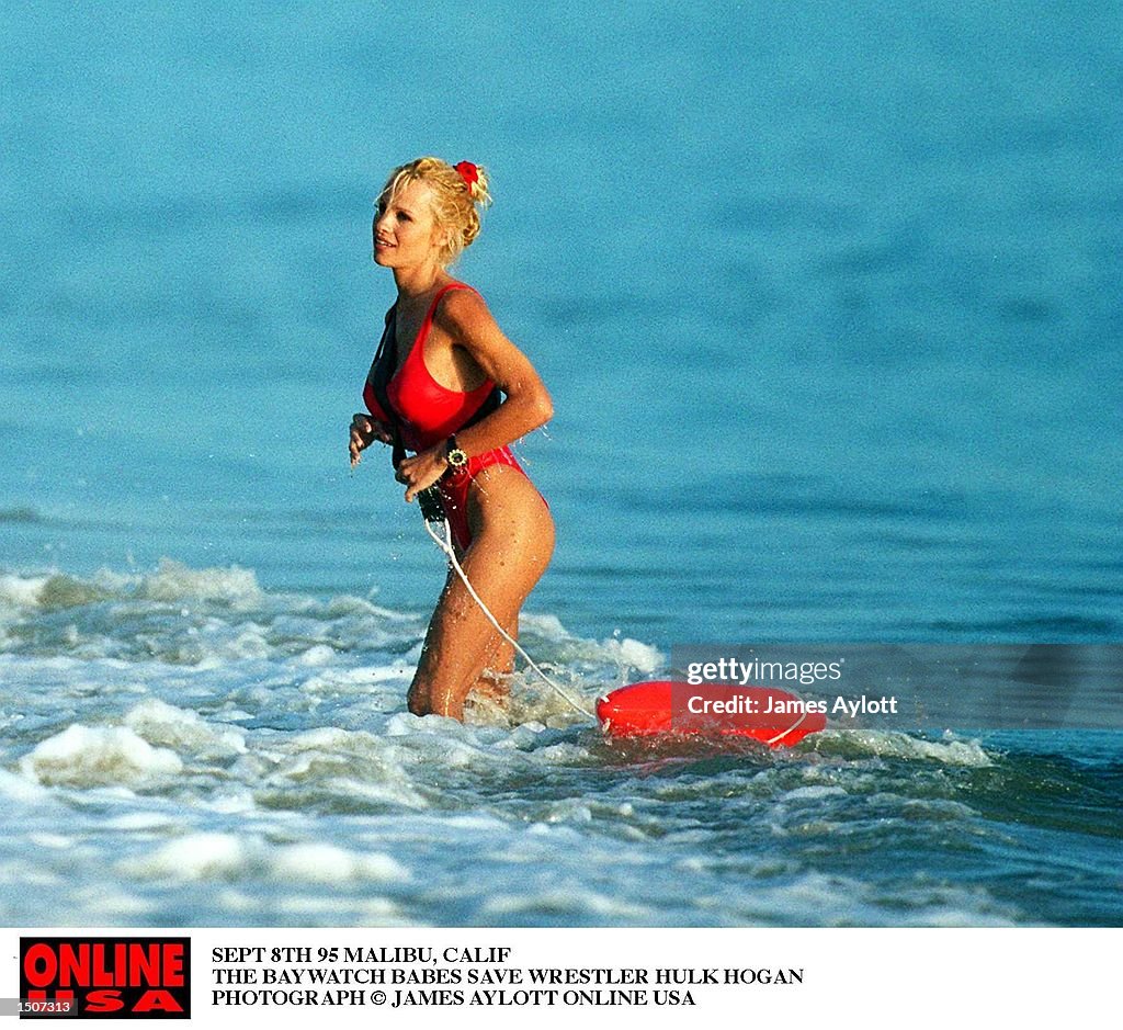 SEPT 8TH 85 MALIBU, CALIF BAYWATCH FILMING THE BAY WATCH BABES SAVE WRESTLER HULK HOGAN FROM DROWNIN