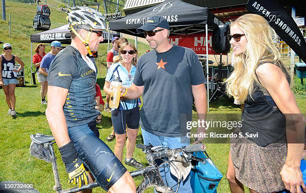 Lance Armstrong and Anna Hansen-Armstrong speak after the Power of Four Mountain Bike Race on Aspen Mountain on August 25, 2012 in Aspen, Colorado.