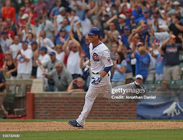 Anthony Rizzo of the Chicago Cubs runs the bases after hitting a game-winning, walk-off home run in the 10th inning against the St. Louis Cardinals...