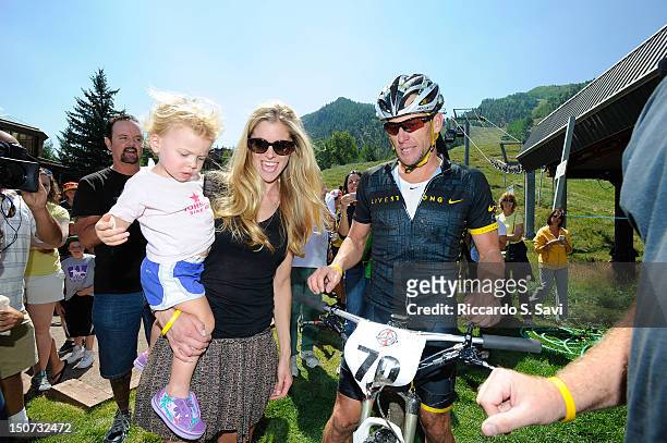 Anna Hansen Armstrong and Lance Armstrong meet after the Power of Four Mountain Bike Race on Aspen Mountain on August 25, 2012 in Aspen, Colorado.