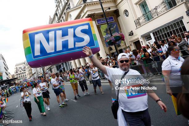 Employees marching towards Trafalgar Square during the Gay Pride Parade on July 01, 2023 in London, England. Pride in London is an annual LGBT+...