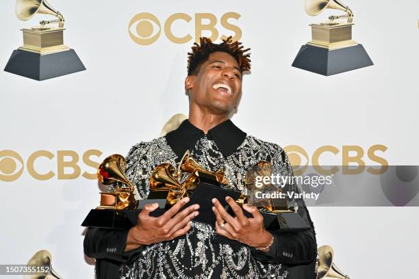 John Batiste, winner of Best American Roots Performance for "Cry," poses in the press room at the 64th Annual Grammy Awards held at the MGM Grand...