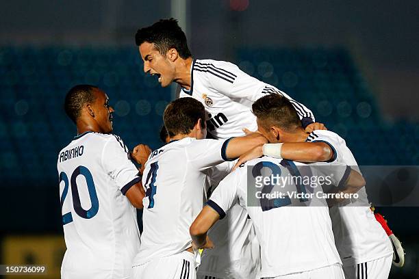 Juanfran Moreno of Real Madrid Castilla celebrates with his teammates after scoring his team's first goal during the La Liga Adelante match between...