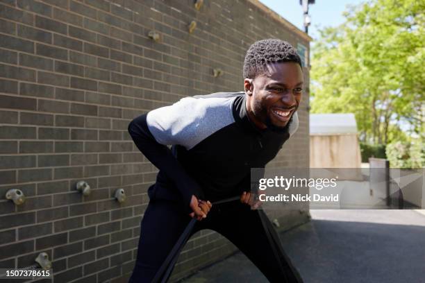 a man fitness training using a resistance band - pursuit sports competition format stock pictures, royalty-free photos & images