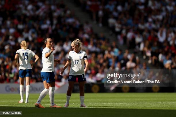 Lucy Bronze and Laura Coombs of England talk during the Women's International Friendly match between England and Portugal at Stadium mk on July 01,...