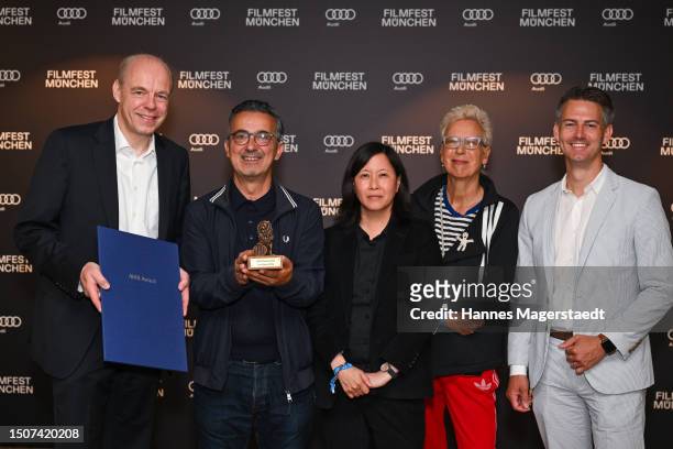Stephan Schenk , Kim Yutani and Doris Dörrie present the award on behalf of "LES FILLES D'OLFA" by Kaouther Ben Hania, Produced by Nadim Cheikhrouha,...