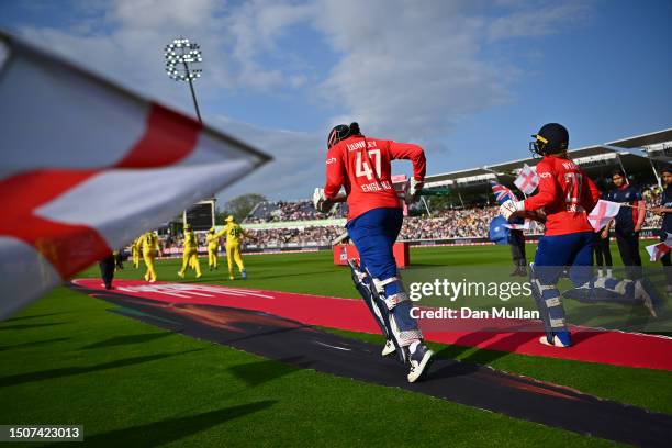 Sophia Dunley and Danni Wyatt of England make their way out to open the batting during the Women's Ashes 1st Vitality IT20 match between England and...