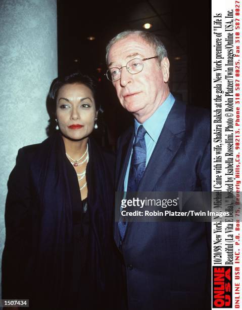 New York, NY. Michael Caine with his wife, Shakira Baksh at the gala New York premiere of "Life Is Beautiful ," hosted by Isabella Rossellini.