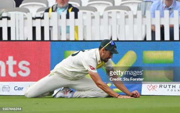 Mitchell Starc of Australia catches out Ben Duckett of England before being overturned by the Third Umpire as not out during Day Four of the LV=...