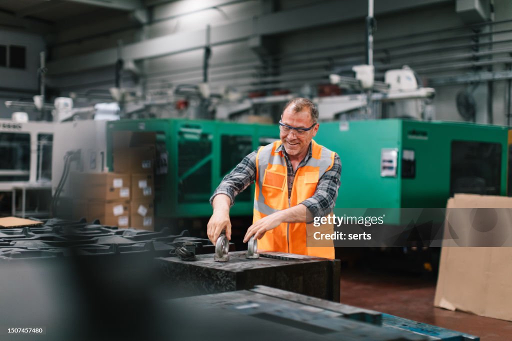 Machine Maker Apprentice Male Apprentice Engineer Working With Cnc Machine In Factory High-Res ...