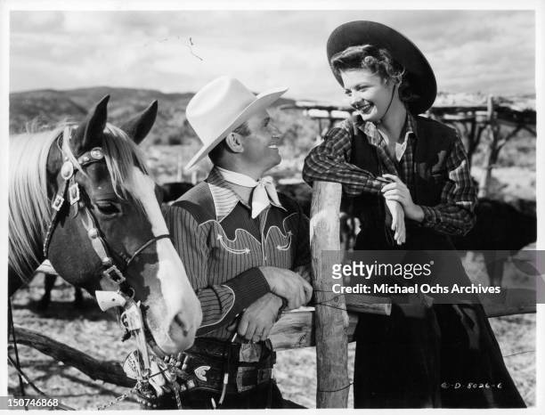 Gene Autry with his horse and Gail Davis in a scene from the film 'Whirlwind', 1951.