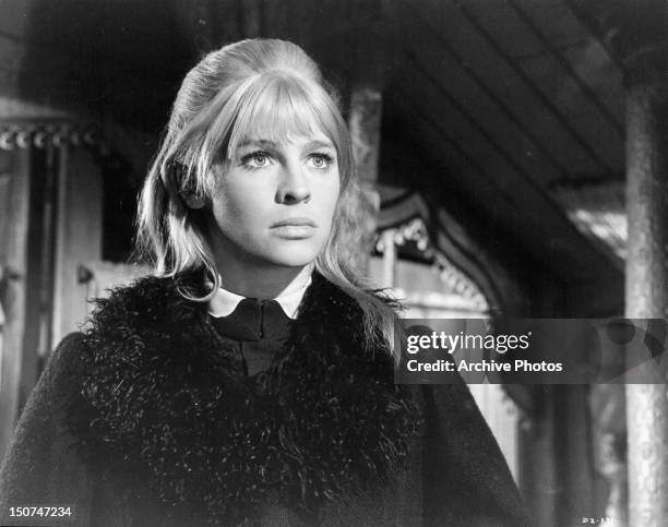 Julie Christie with a serious look on her face in a scene from the film 'Doctor Zhivago', 1965.