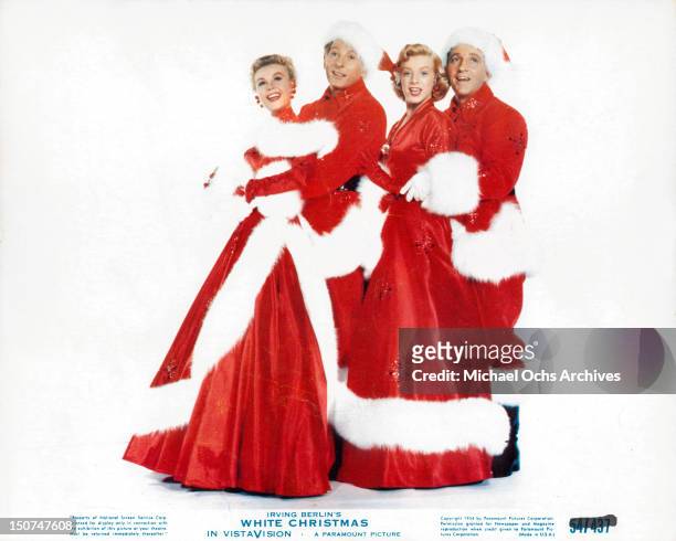 Vera-Ellen, Danny Kaye, Rosemary Clooney and Bing Crosby dressed in Christmas stage costumes in a scene from the film 'White Christmas', 1954.