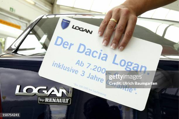 Price label of a Dacia Logan in the showroom of a Renault car dealer.