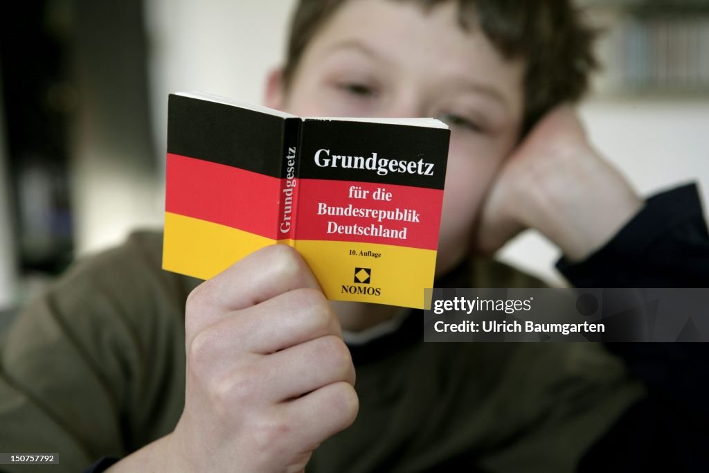 GERMANY, BONN, Children reading the Basic Law for the Federal Republic of Germany.