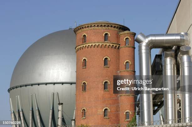 Gas storage tanks of the Berliner Gaswerke AG with a historic water tower.