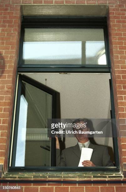 Guido WESTERWELLE, secretary-general of the FDP, looks out of a window of the FDP headquarters in Berlin.