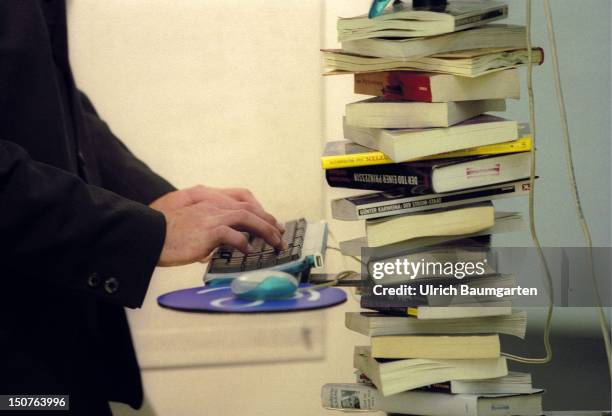 Computer mouse with a pile of books, Book fair 2001