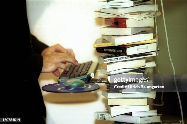 Computer mouse with a pile of books, Book fair 2001