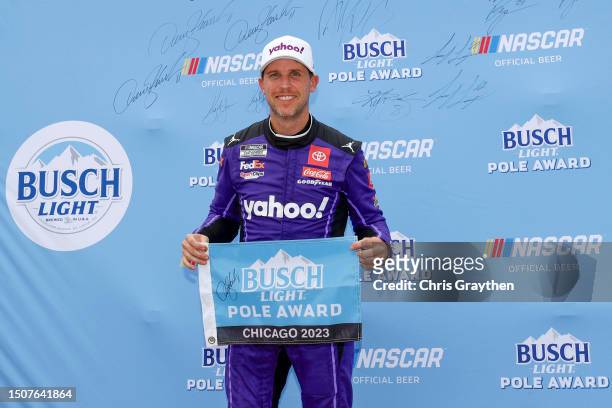 Denny Hamlin, driver of the Yahoo! Toyota, poses for photos after winning the pole award during qualifying for the NASCAR Cup Series Grant Park 220...