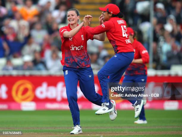 Lauren Bell and Sophia Dunkley of England celebrate the wicket of Alyssa Healy of Australia during the Women's Ashes 1st Vitality IT20 match between...