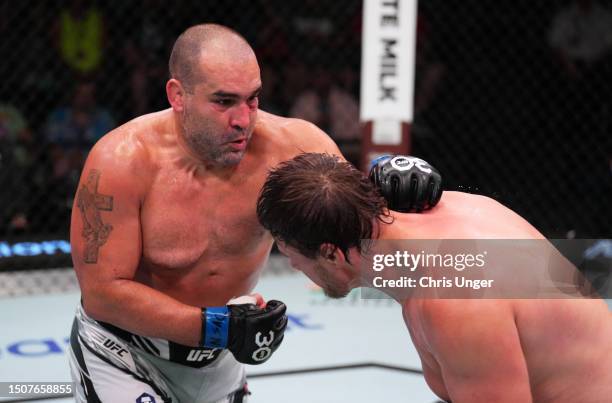 Blagoy Ivanov of Bulgaria punches Alexandr Romanov of Moldova in a heavyweight fight during the UFC Fight Night event at UFC APEX on July 01, 2023 in...