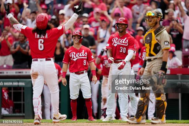Jonathan India, Matt McLain, and Will Benson of the Cincinnati Reds celebrate after India hit a grand slam in the seventh inning against the San...