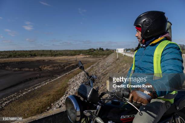 Person looks the Santa Lucia river at Paso Severino reservoir on July 01, 2023 in Florida, Uruguay. 'La Niña' climatic phenomenon has brought Uruguay...
