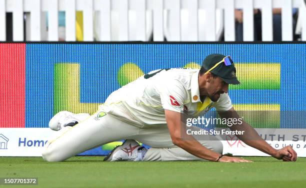 Mitchell Starc of Australia catches out Ben Duckett of England before being overturned by the Third Umpire as not out during Day Four of the LV=...