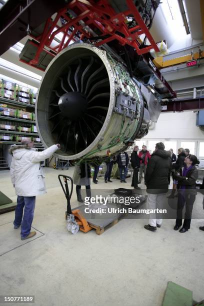Aero-engines at MTU Aero Engines, Our picture shows group of visitors at PW 1000G engine for latest aircraft projects such as the Airbus A 320 Neo.