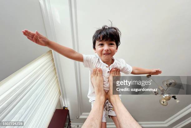 father and son playing at home - crazy dad stock pictures, royalty-free photos & images
