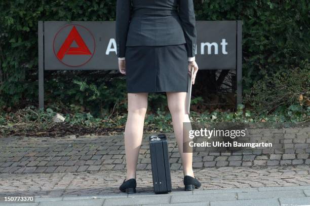 Qualified and unemployed, Businesswoman infront sign of employment office.