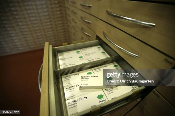 Medicine Tamiflu against flu, produced by Roche with the ingredient Oseltamivir lying in a drawer.