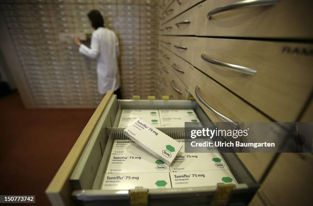 Medicine Tamiflu against flu, produced by Roche with the ingredient Oseltamivir lying in a drawer.