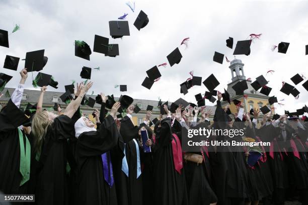 Graduates with academic gown and birettas during graduation ceremony at the Rheinische Friedrich-Wilhelms-University Bonn, O,p,s, After the...