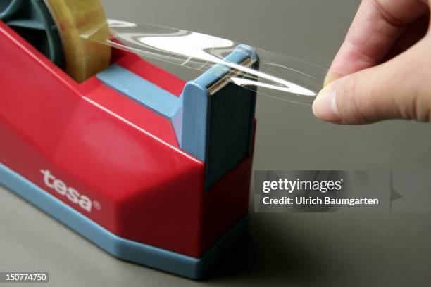 Tape dispenser with adhesive tape from the German brand tesa.