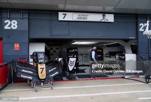 Fiction F1 team garage arranged for filming of the upcoming movie Apex starring Brad Pitt on paddock day ahead of the British Grand Prix 2023 at...