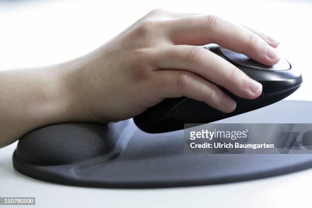 Health at work, Our picture shows a hand with computer mouse on an ergonomic mousepad with built-in wrist rest made of silicone gel.