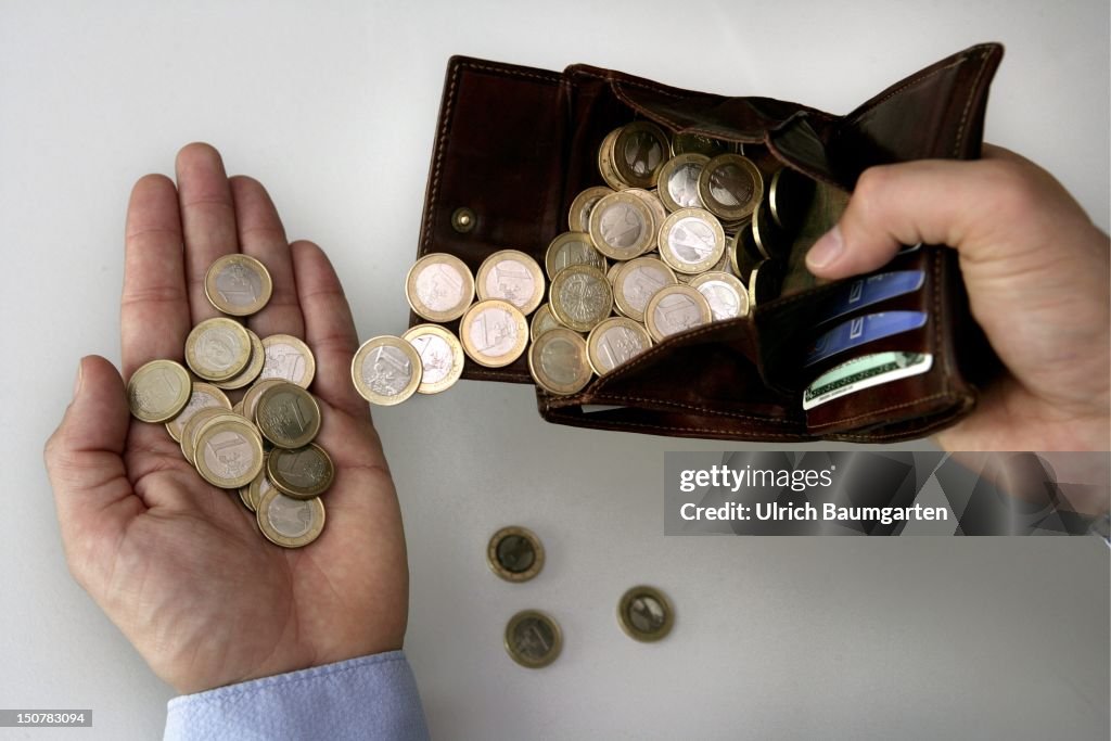One Euro coins in a purse.