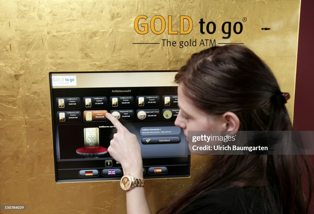 GERMANY, WIESBADEN, Gold to go - real gold bars and gold coins, one can avail oneself directly at a gold machine in Wiesbaden - from one gram bar to a 250 gram gold boulder depending on the purse.