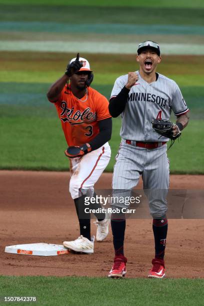Carlos Correa of the Minnesota Twins celebrates after tagging Jorge Mateo of the Baltimore Orioles stealing second base in the ninth inning at Oriole...