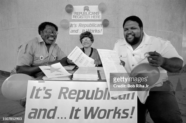 Election Volunteers Al Thompson, Mabel Holt and James Stratton with sign-up table to register Republican new voters in an effort to attract black...