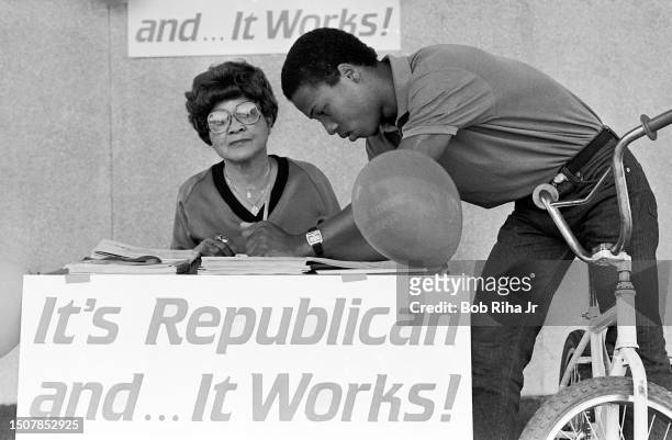 Election Volunteer Mabel Holt registers Greg Smith to vote as Republicans launch a new effort to attract black voters for upcoming election, May 17,...