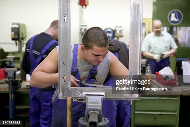 Handicraft apprentice who's being trained at the - Bildungszentrum Butzweiler Hof der Handwerkskammer Koeln - to become a metal worker.