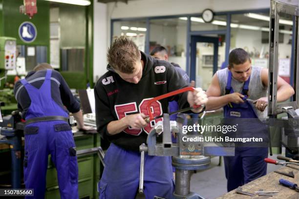 Handicraft apprentice who's being trained at the - Bildungszentrum Butzweiler Hof der Handwerkskammer Koeln - to become a metal worker.