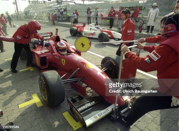 Formula 1- race on the Nuerburgring, The racing car of Michael SCHUMACHER is refuelled at the Ferrari - box.