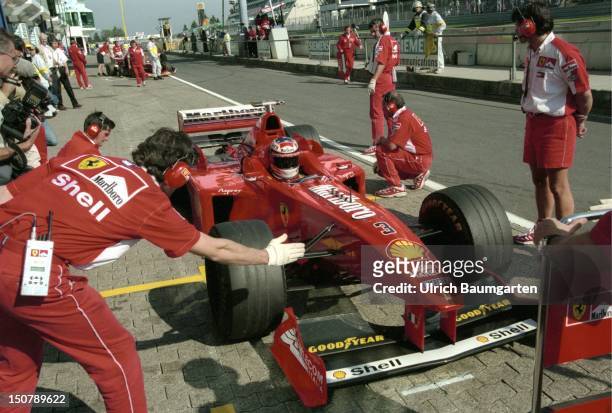 Formula 1- race on the Nuerburgring, The racing car of Michael SCHUMACHER during a stop in the Ferrari - box.
