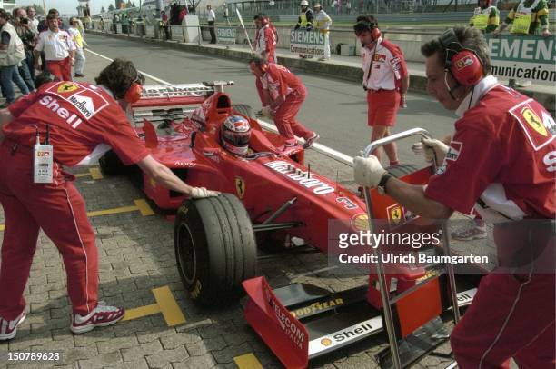 Formula 1- race on the Nuerburgring, The racing car of Michael SCHUMACHER during a stop at the Ferrari - box.